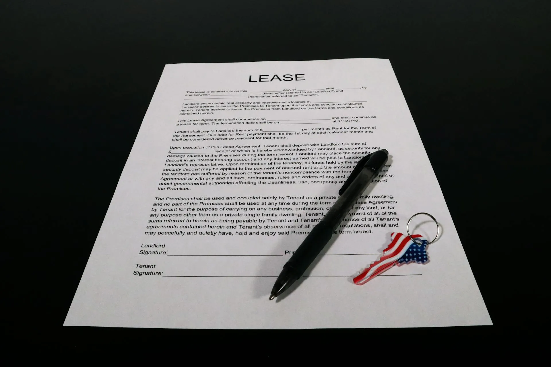Lease agreement document with pen and keychain on a tabletop — rental handover and bond compliance context